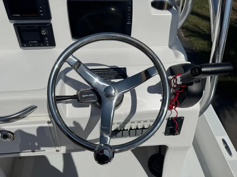 Slide: The Image of Steering wheel of 2019 Shallow Sport 21 Sport boat with control panel and throttle. - 8