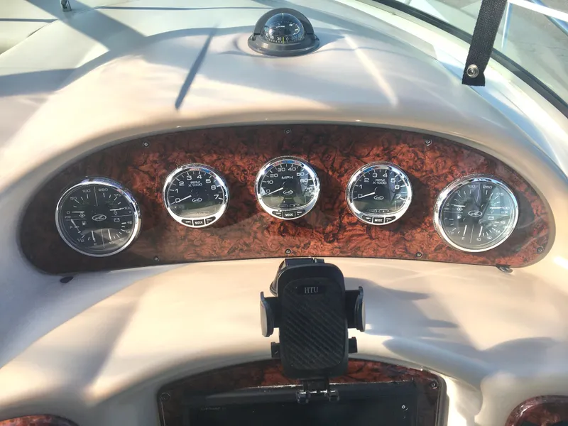 Slide: The Image of Dashboard of 2004 Sea Ray 340 Sundancer with gauges and controls. - 12