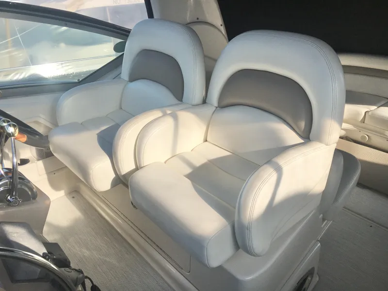 Slide: The Image of Luxury seating on a 2004 Sea Ray 340 Sundancer boat, featuring plush white upholstery. - 13