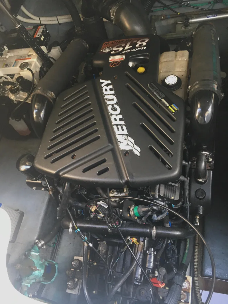 Slide: The Image of Engine compartment of a 2004 Sea Ray 340 Sundancer with a Mercury engine. - 30