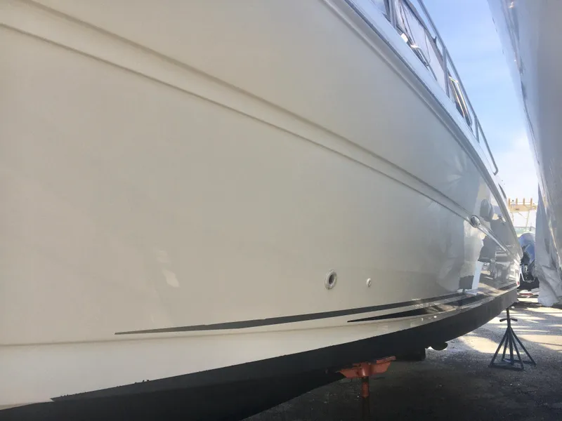 Slide: The Image of 2004 Sea Ray 340 Sundancer boat hull on dry dock, side view. - 7