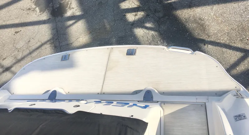 Slide: The Image of 2004 Sea Ray 340 Sundancer boat deck, viewed from above, showing clean surface and fittings. - 9