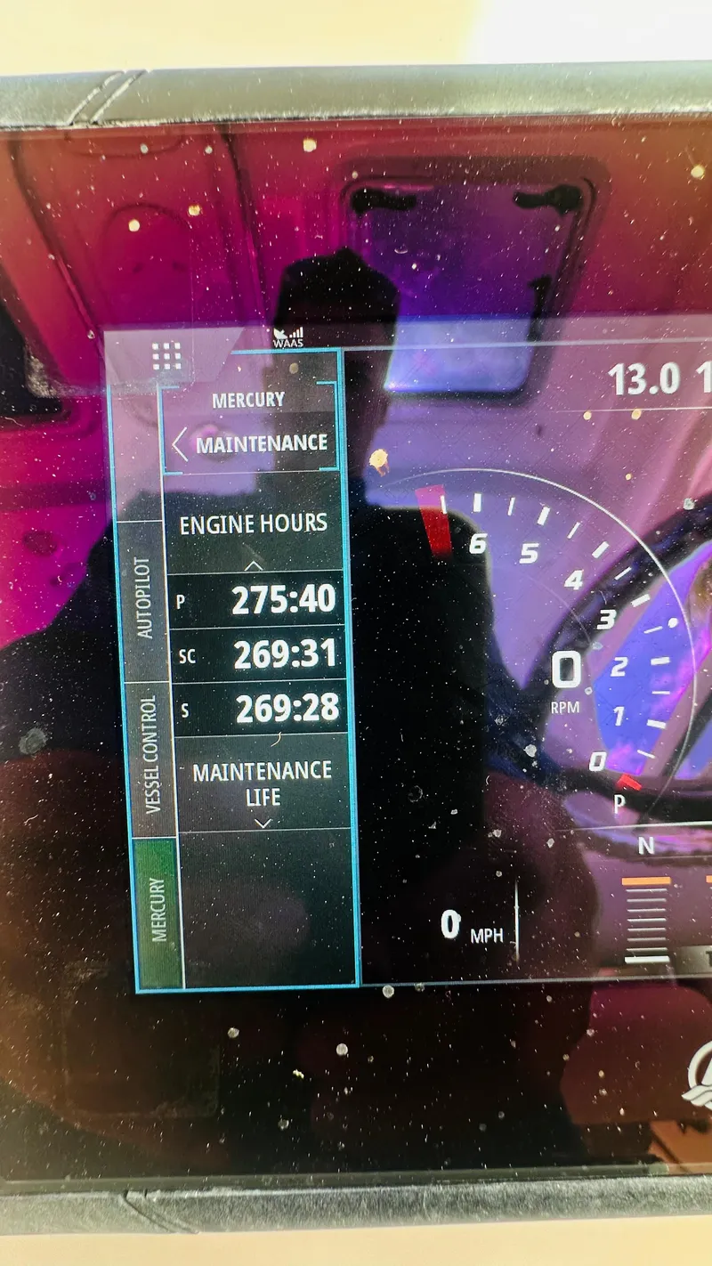 Slide: The Image of Display screen showing engine hours on a 2018 Boston Whaler 345 Conquest boat. - 11