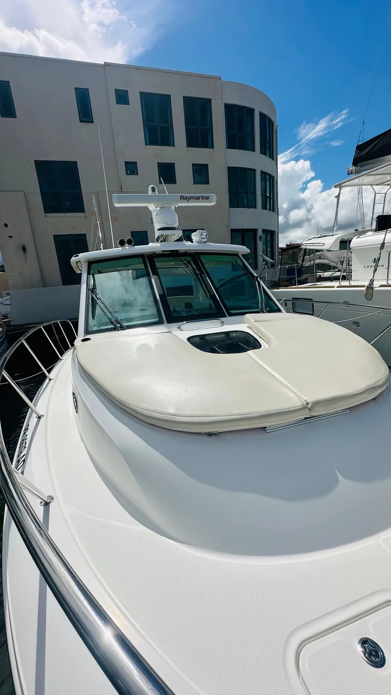 Slide: The Image of 2018 Boston Whaler 345 Conquest docked, showcasing sleek design and modern features. - 13