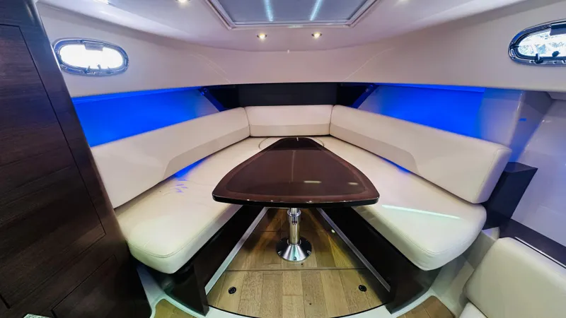 Slide: The Image of 2018 Boston Whaler 345 Conquest cabin with modern seating and ambient lighting. - 19