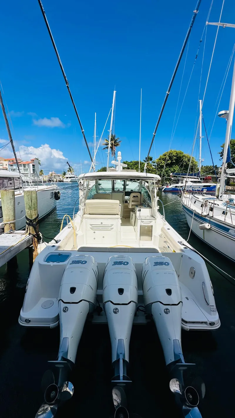 Slide: The Image of 2018 Boston Whaler 345 Conquest interior kitchen with modern appliances and wood finish. - 2