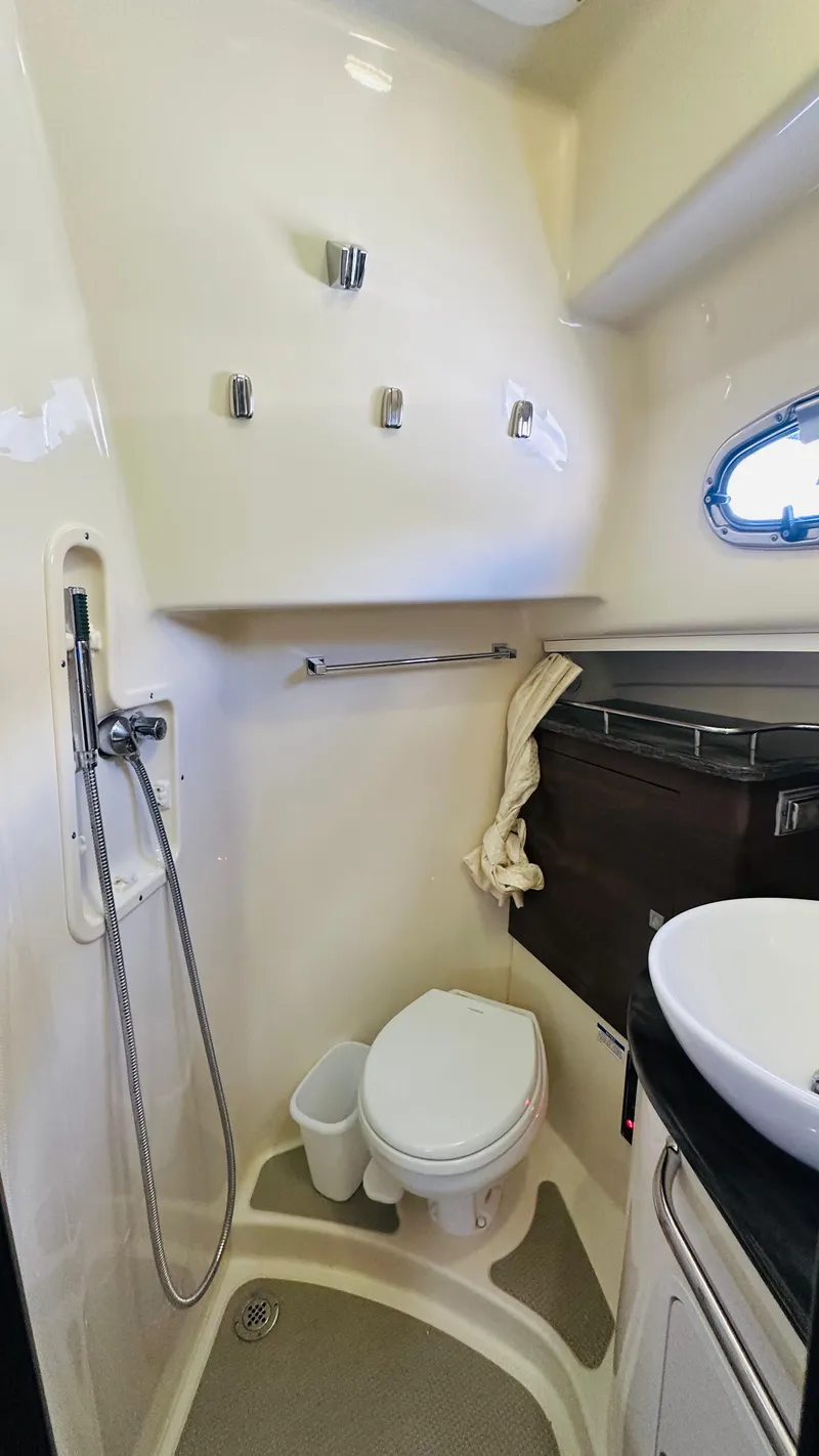 Slide: The Image of 2018 Boston Whaler 345 Conquest bathroom with shower, toilet, and sink. - 20