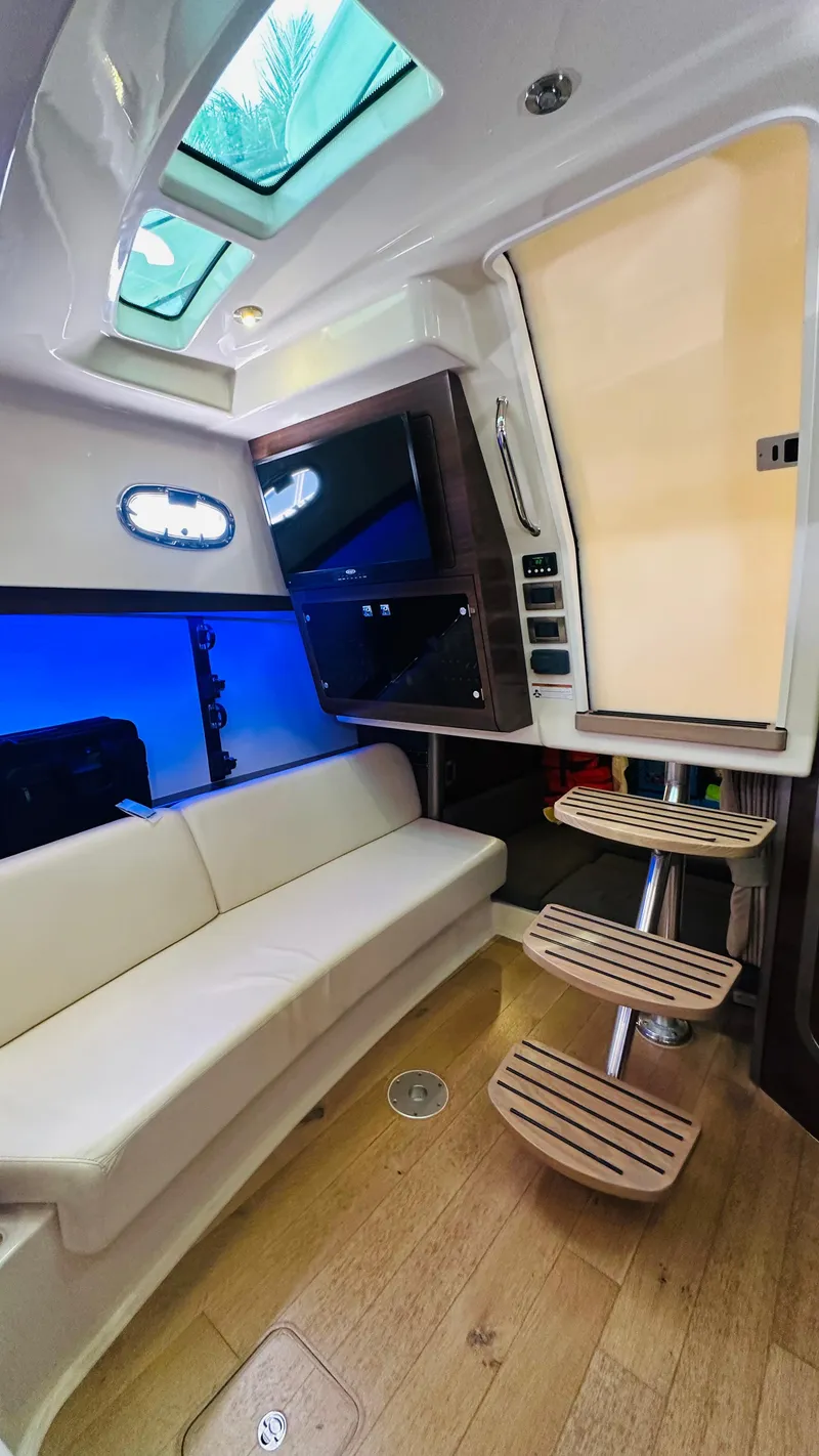 Slide: The Image of Interior of 2018 Boston Whaler 345 Conquest with modern seating and entertainment system. - 21