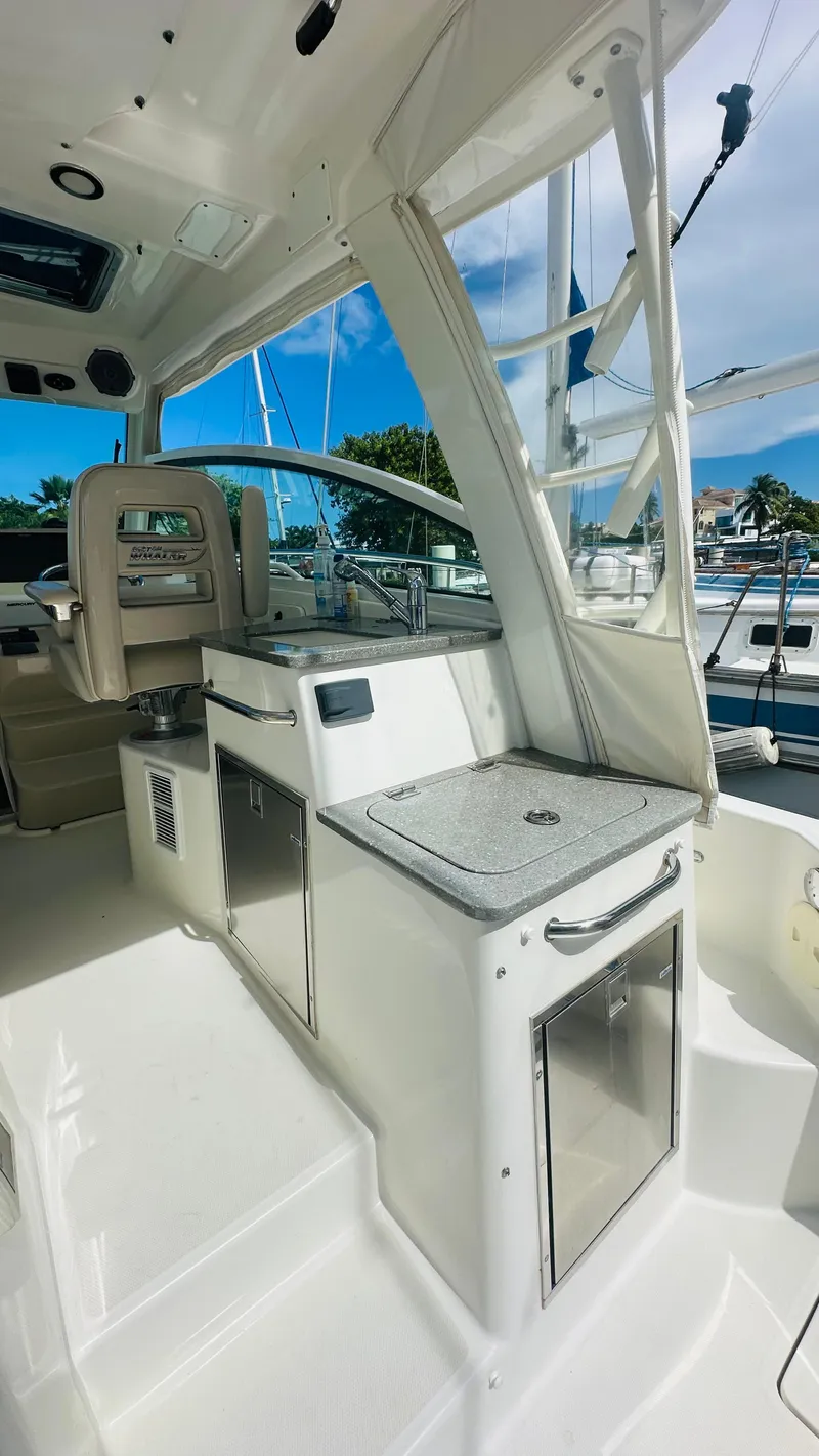 Slide: The Image of Luxurious interior of 2018 Boston Whaler 345 Conquest with elegant seating and ambient lighting. - 7
