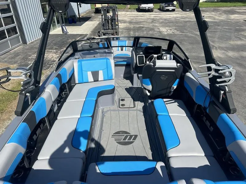 Slide: The Image of 2022 Malibu Wakesetter 23 LSV interior with blue and gray seating, sleek design. - 3