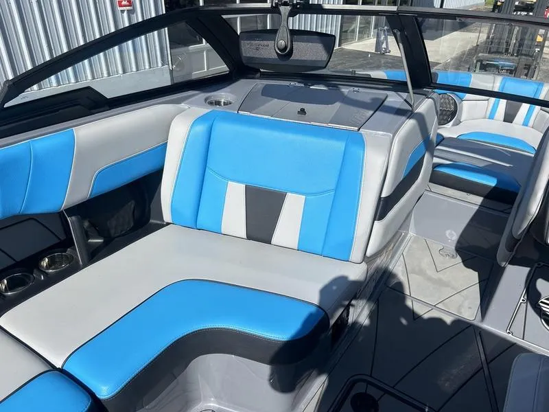 Slide: The Image of 2022 Malibu Wakesetter 23 LSV interior with blue and gray seating, modern design. - 5