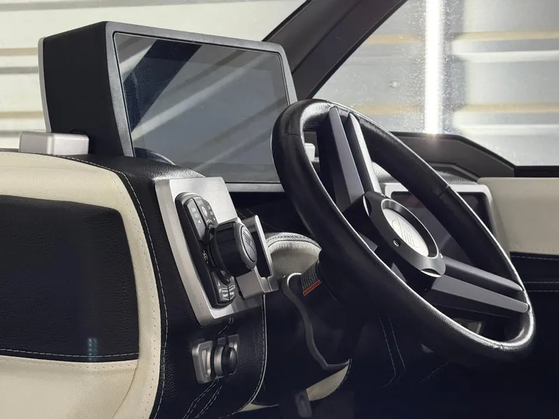 Slide: The Image of 2017 Malibu Wakesetter 23 LSV dashboard with steering wheel and control panel. - 11