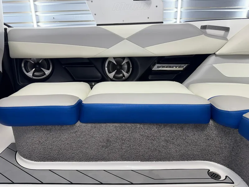 Slide: The Image of 2017 Malibu Wakesetter 23 LSV interior with stylish seating and built-in speakers. - 13