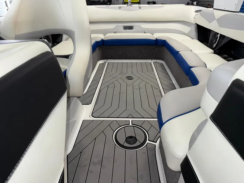 Slide: The Image of 2017 Malibu Wakesetter 23 LSV interior with sleek seating and modern flooring design. - 15