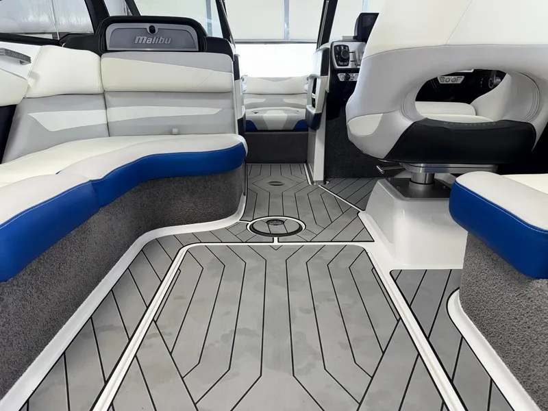 Slide: The Image of 2017 Malibu Wakesetter 23 LSV interior with gray flooring and white-blue seating. - 16