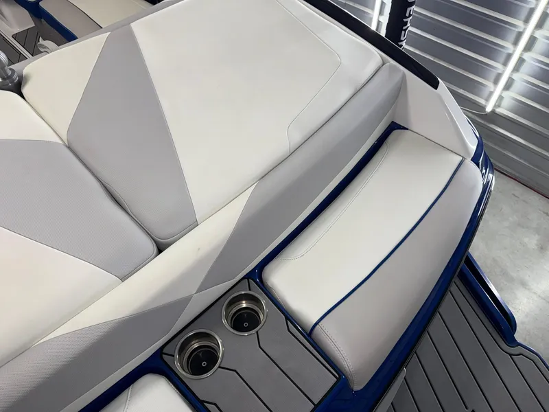 Slide: The Image of 2017 Malibu Wakesetter 23 LSV interior seating with cup holders and sleek design. - 20