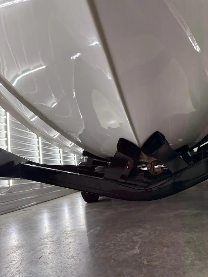 Slide: The Image of 2017 Malibu Wakesetter 23 LSV boat hull in storage, close-up view. - 22