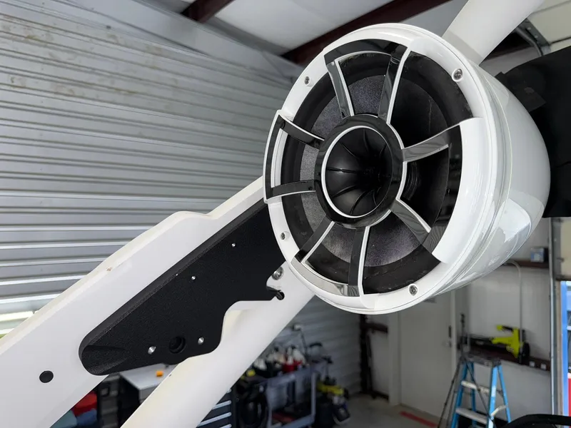 Slide: The Image of Close-up of a 2017 Malibu Wakesetter 23 LSV boat speaker in a garage setting. - 24