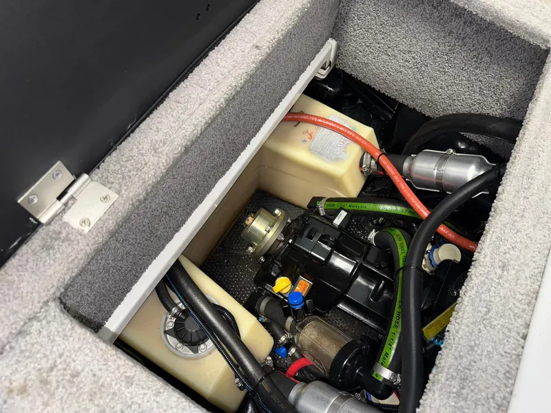 Slide: The Image of Engine compartment of a 2017 Malibu Wakesetter 23 LSV boat, showing various components and wiring. - 28