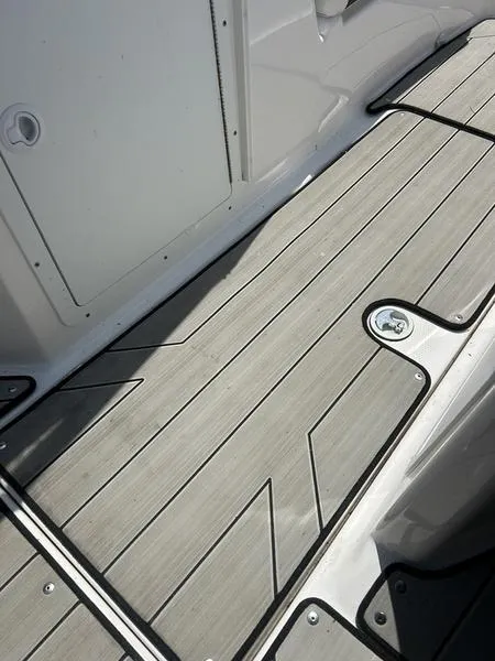 Slide: The Image of 2022 Yamaha Boats 212XE deck with sleek, modern design and durable materials. - 14