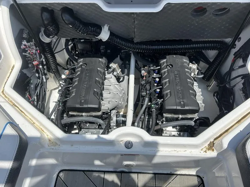 Slide: The Image of 2022 Yamaha Boats 212XE engine compartment with dual engines and wiring. - 7