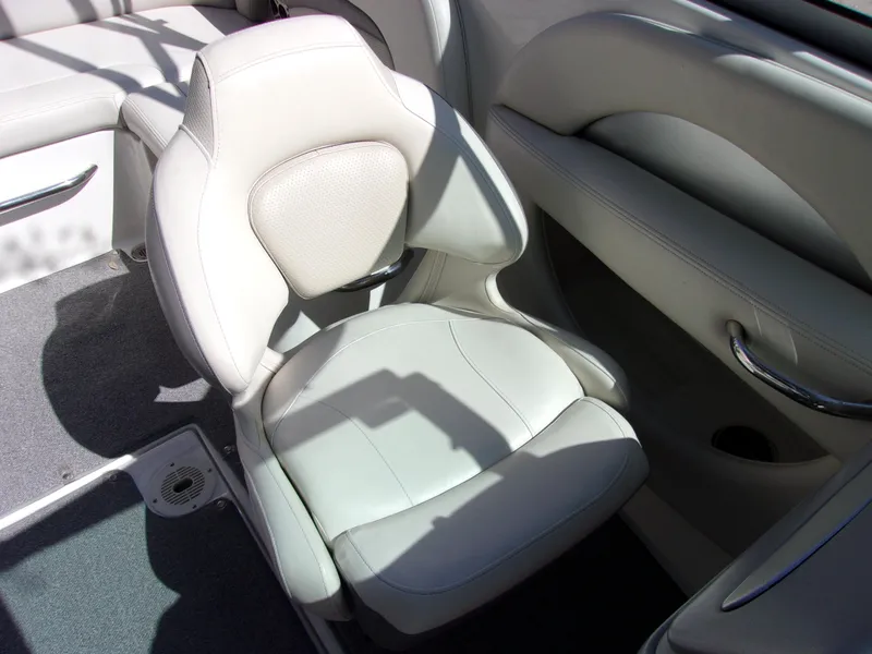 Slide: The Image of 2009 Chaparral 226 SSi boat interior with white leather seating and sleek design. - 10