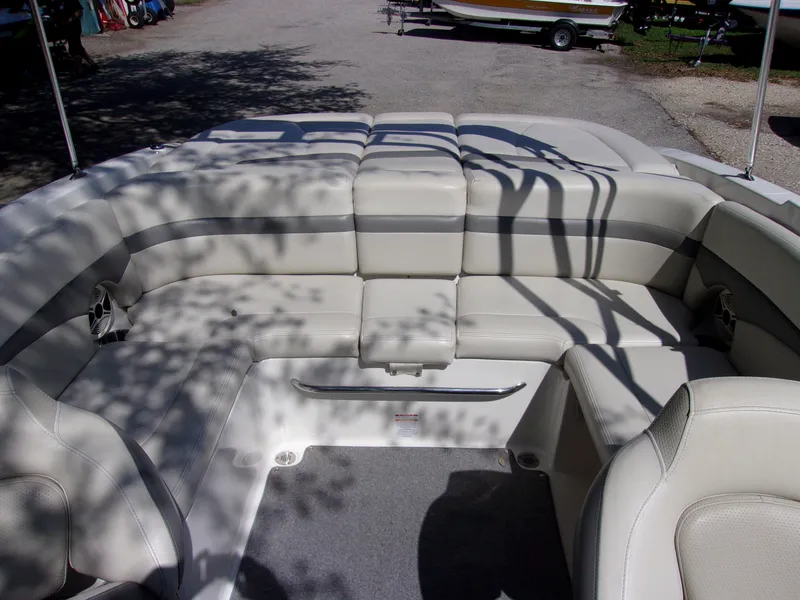 Slide: The Image of 2009 Chaparral 226 SSi boat interior with beige seating and shadow patterns. - 11
