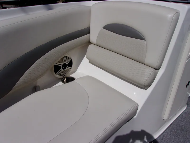 Slide: The Image of 2009 Chaparral 226 SSi boat interior with cushioned seating and speaker. - 17