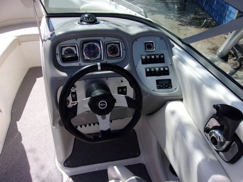 Slide: The Image of 2009 Chaparral 226 SSi boat dashboard with steering wheel and control panel. - 5