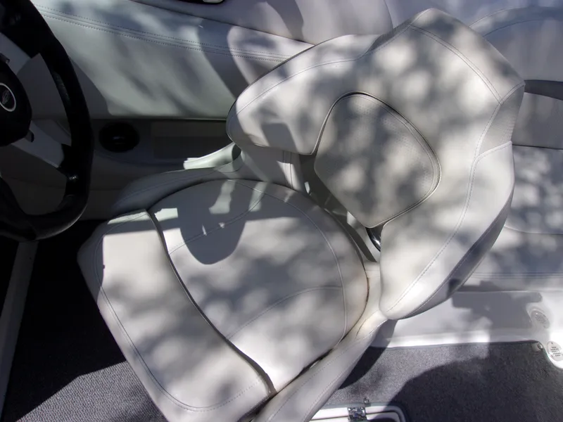 Slide: The Image of 2009 Chaparral 226 SSi boat seat with light upholstery and shadow patterns. - 7