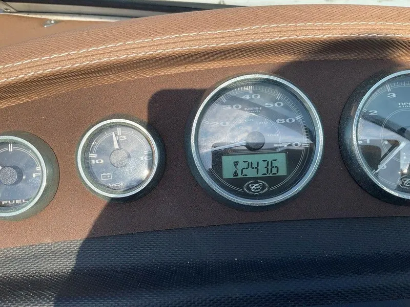 Slide: The Image of Dashboard of a 2013 Cobalt 210 boat showing speedometer and fuel gauge. - 16