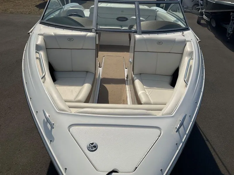Slide: The Image of 2013 Cobalt 210 boat with white interior and open bow seating. - 20