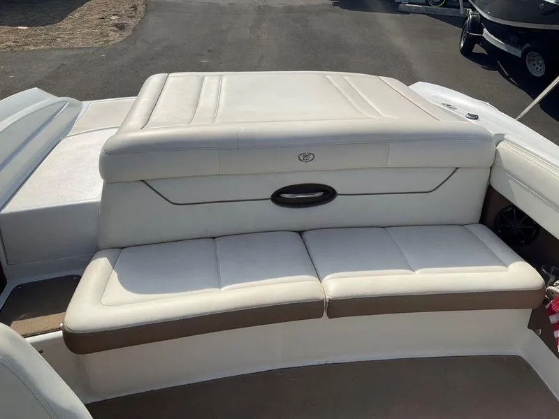 Slide: The Image of 2013 Cobalt 210 boat with white leather seating and storage compartment. - 4