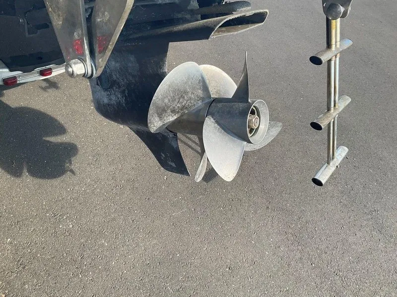 Slide: The Image of Propeller of a 2013 Cobalt 210 boat on a paved surface. - 5