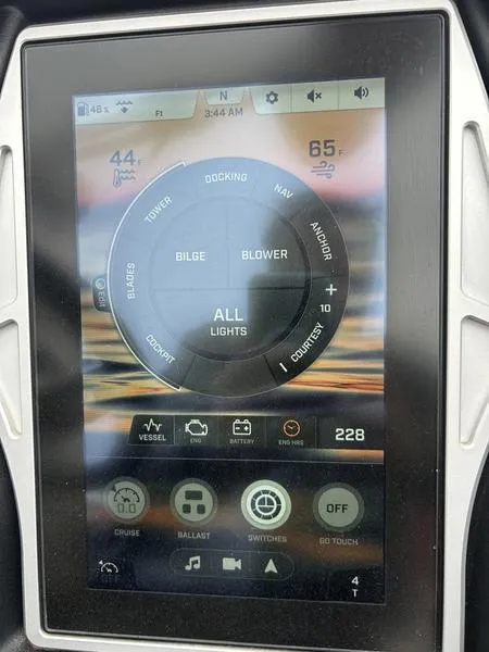 Slide: The Image of Touchscreen control panel of a 2020 Tigé 23ZX boat displaying various navigation and system settings. - 2