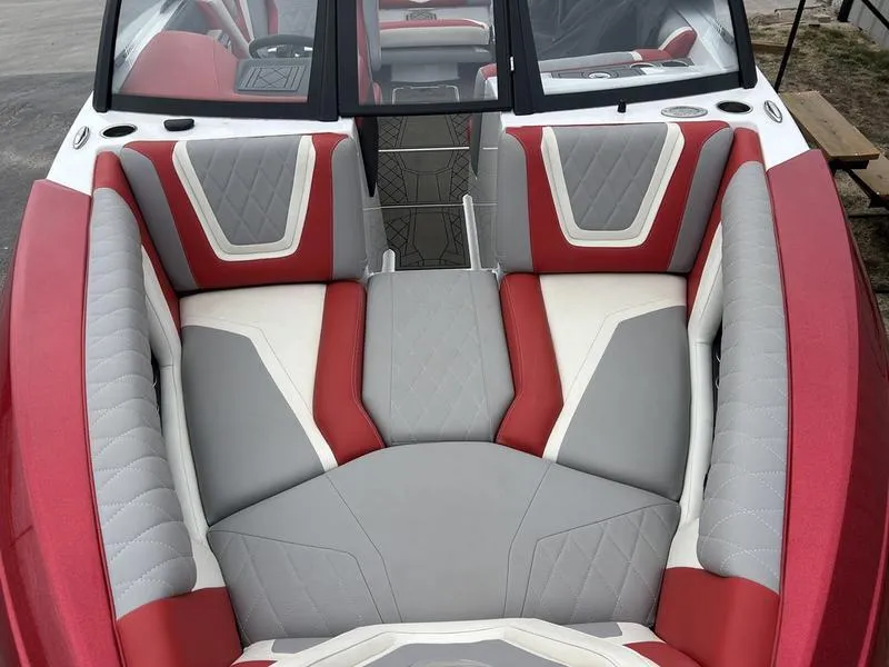 Slide: The Image of 2020 Tigé 23ZX boat interior with red, gray, and white seating. - 5