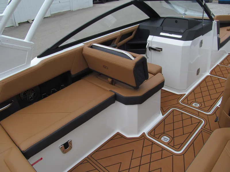Slide: The Image of 2025 Cobalt R6 boat interior with tan leather seats and modern design. - 10