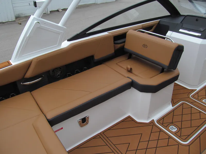 Slide: The Image of 2025 Cobalt R6 boat interior with tan leather seating and modern design. - 11