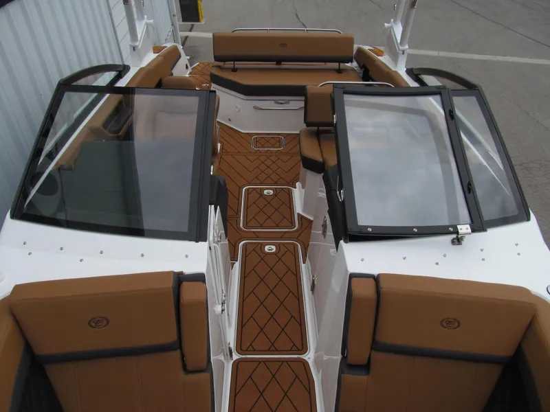 Slide: The Image of 2025 Cobalt R6 boat interior with tan seating and sleek design. - 18