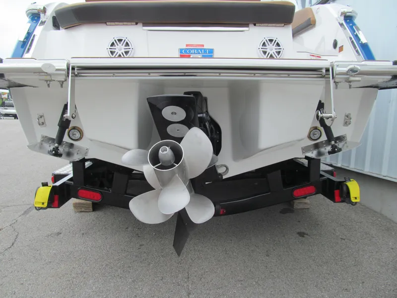Slide: The Image of Rear view of 2025 Cobalt R6 boat with propeller and trailer. - 6