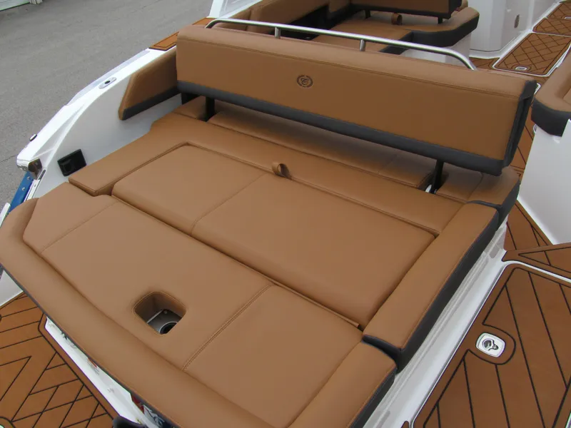 Slide: The Image of 2025 Cobalt R6 boat with luxurious brown leather seating and sleek design. - 7