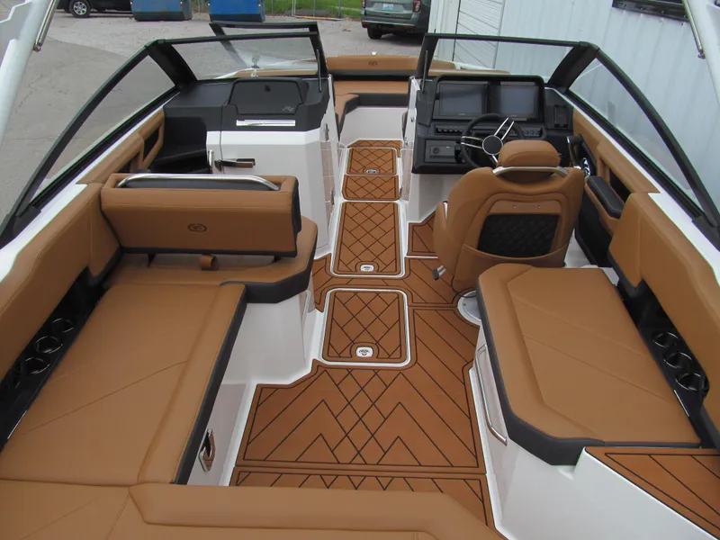 Slide: The Image of 2025 Cobalt R6 boat interior with tan seating, modern dashboard, and sleek design. - 9