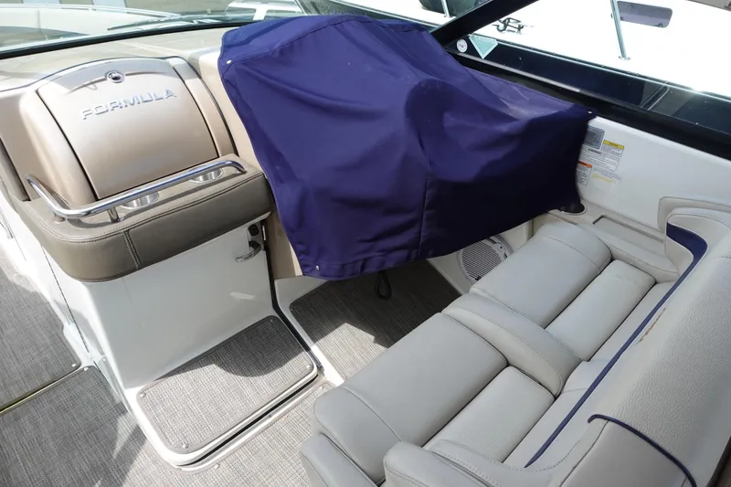 Slide: The Image of 2015 Formula 350 Crossover Bowrider interior with covered seating and elegant design. - 10