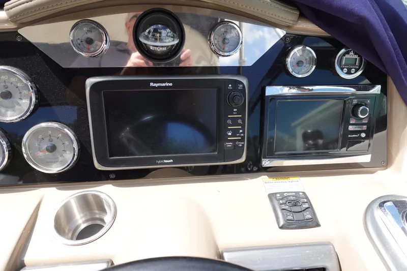 Slide: The Image of Dashboard of a 2015 Formula 350 Crossover Bowrider with navigation and control systems. - 13