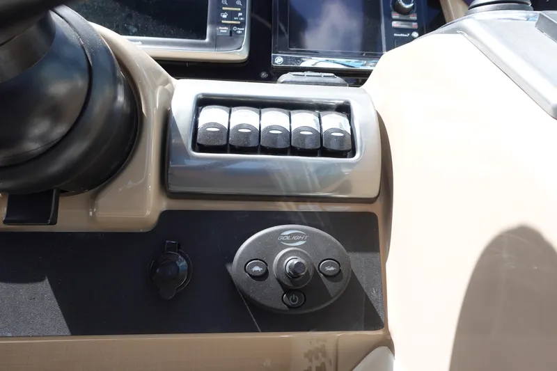 Slide: The Image of Control panel of 2015 Formula 350 Crossover Bowrider boat with switches and joystick. - 16