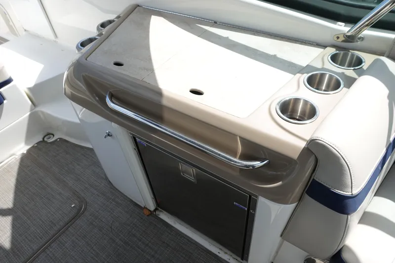 Slide: The Image of 2015 Formula 350 Crossover Bowrider interior with cup holders and storage area. - 18