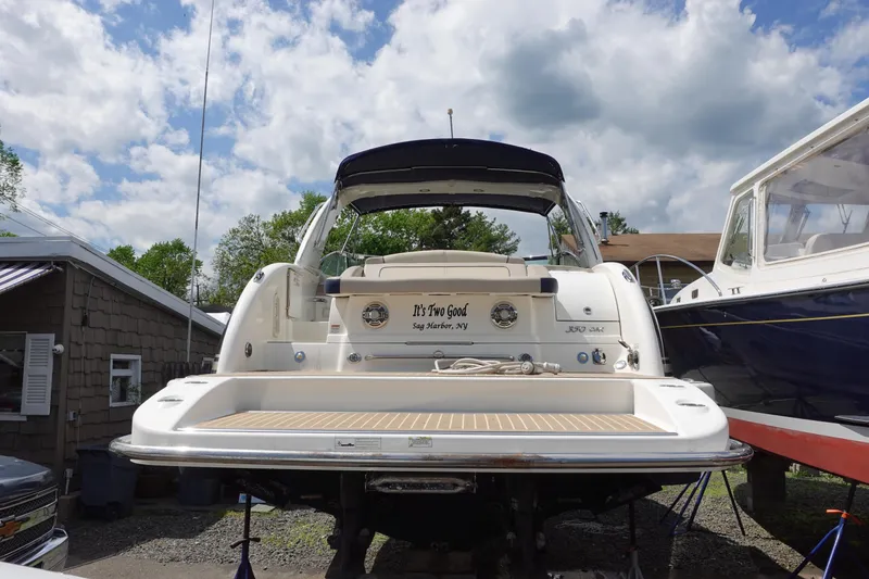Slide: The Image of 2015 Formula 350 Crossover Bowrider boat on display, rear view with swim platform. - 2