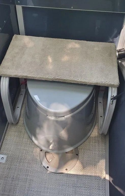 Slide: The Image of Portable toilet with carpeted lid in 2017 Regency 220 DL3 boat. - 13