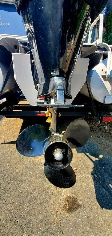Slide: The Image of Rear view of a 2017 Regency 220 DL3 boat propeller on a trailer. - 29
