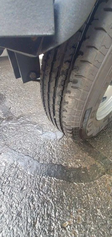 Slide: The Image of Close-up of a 2017 Regency 220 DL3 tire on wet pavement. - 34